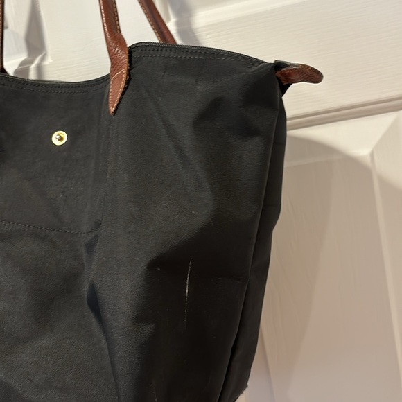 Black long champ shoulder bag. Has been worn and lots of wear and tear. - Picture 5 of 11